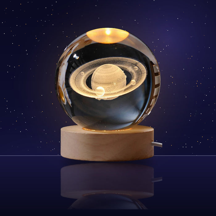 Lámpara bola de cristal Saturno encendida