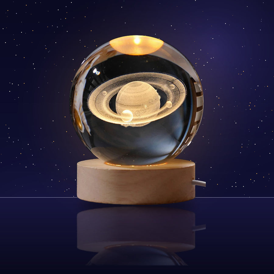 Lámpara bola de cristal Saturno encendida
